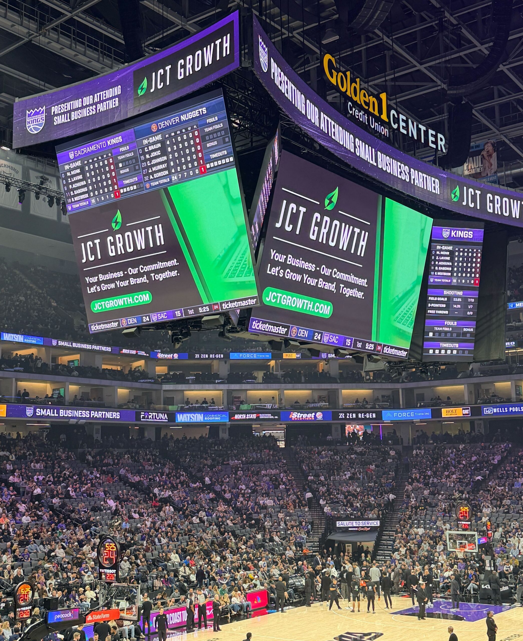 Photo of JCT Growth's logo on the jumbotron at the Kings arena in Sacramento.