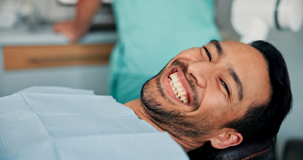 Cosmetic dentistry patient smiling during consultation